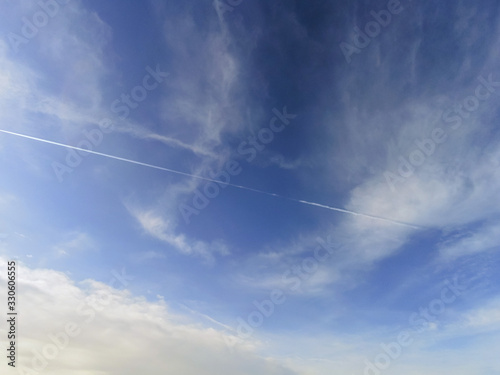 Simple blue cloudy sky. Abstract nature background.