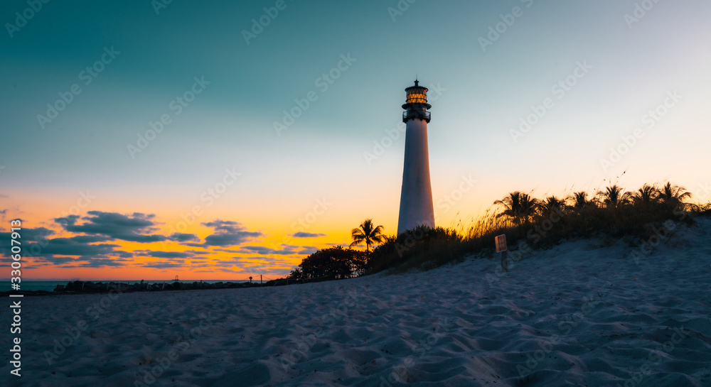 lighthouse sunset sea ocean florida aquatic sky lighting sun coast beach silhouette sunrise cloud dusk orange landscape tower coast