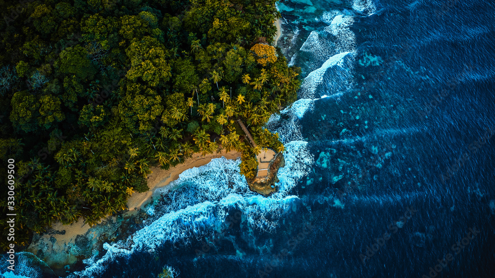 Aerial drone photo of an observation deck placed on a tropic seashore coast surrounded by turquoise transparent ocean, view from the top