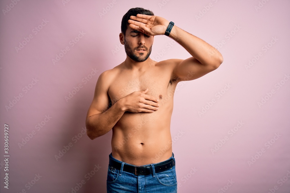 Young handsome strong man with beard shirtless standing over isolated pink background Touching forehead for illness and fever, flu and cold, virus sick Young handsome strong man with beard shirtless standing over isolated pink background Touching forehead for illness and fever, flu and cold, virus sick
