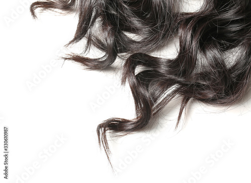 Beautiful long curly hair on white background