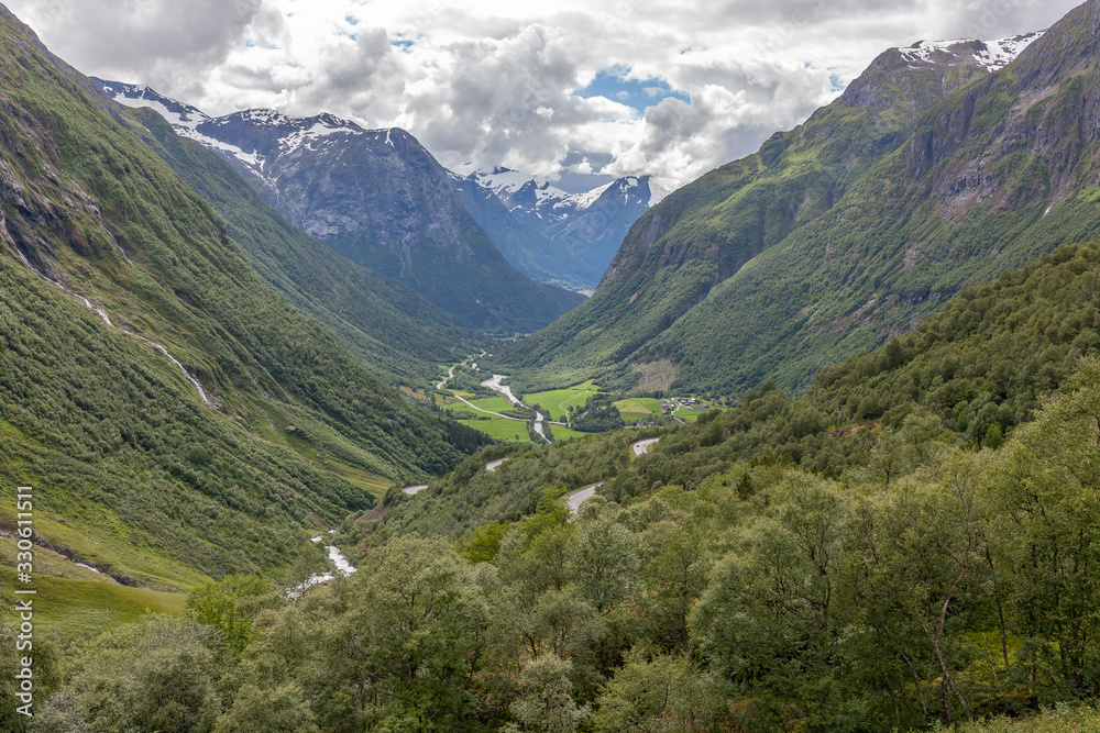 Norway, Beautiful View Of Mountain with cloudy sky and Green Valley, Norway Mountain Landscape selective focus Norway, Beautiful View Of Mountain with cloudy sky and Green Valley, Norway Mountain Landscape selective focus
