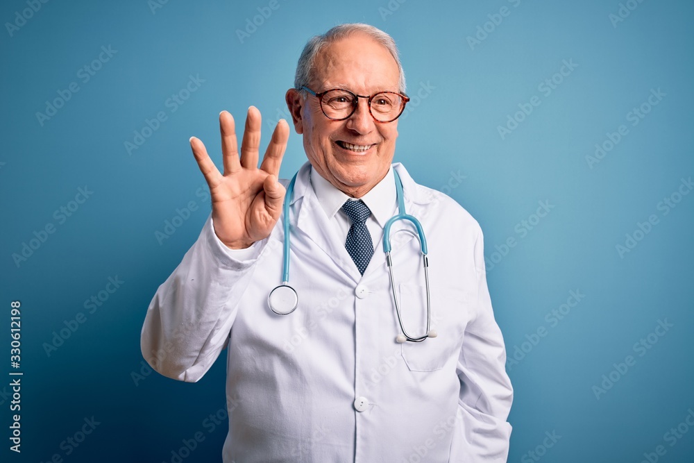 Senior grey haired doctor man wearing stethoscope and medical coat over blue background showing and pointing up with fingers number four while smiling confident and happy. Senior grey haired doctor man wearing stethoscope and medical coat over blue background showing and pointing up with fingers number four while smiling confident and happy.