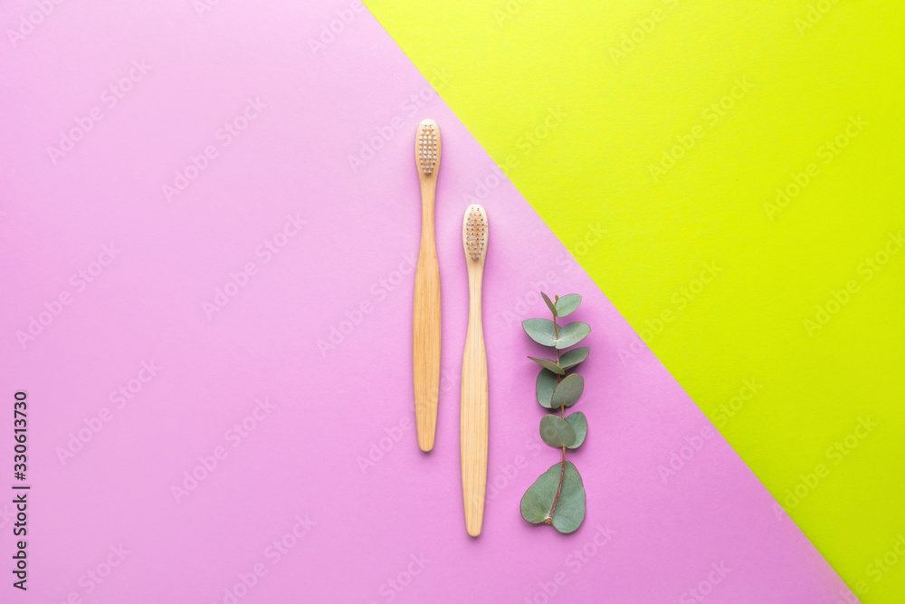 Wooden tooth brushes on color background Wooden tooth brushes on color background
