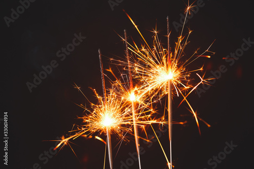 Beautiful Christmas sparklers on dark background