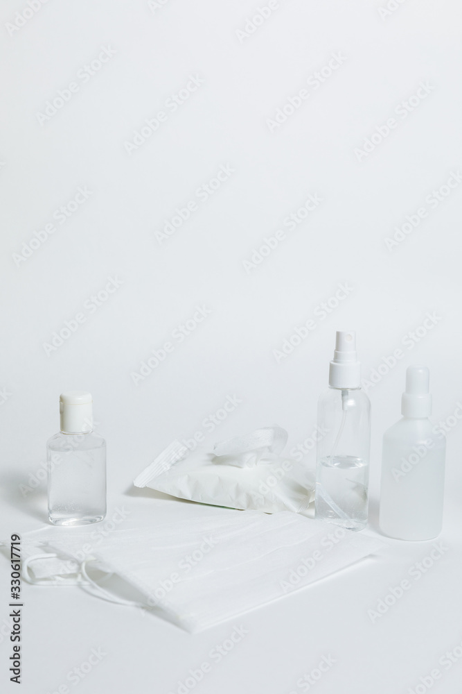Antiseptic gel, sanitary napkins, medical mask, antibacterial spray on a white background. Personal protective hygiene concept. Prevention of coronavirus disease (COVID-19) . Copy space Antiseptic gel, sanitary napkins, medical mask, antibacterial spray on a white background. Personal protective hygiene concept. Prevention of coronavirus disease (COVID-19) . Copy space