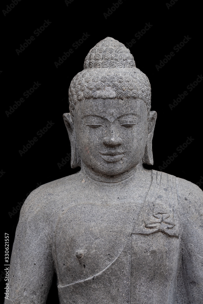 Portrait of a buddha statue, islated on black background. Sign for peace and wisdom Portrait of a buddha statue, islated on black background. Sign for peace and wisdom