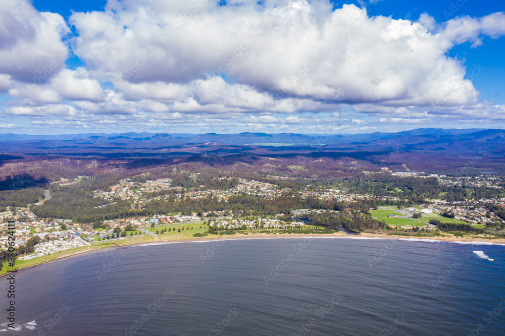 Panoramic aerial drone view of Corrigans Beach at Batemans Bay on the New South Wales South Coast, Australia, on a sunny day