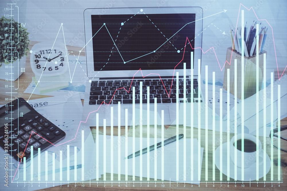 Financial graph colorful drawing and table with computer on background. Double exposure. Concept of international markets. Financial graph colorful drawing and table with computer on background. Double exposure. Concept of international markets.