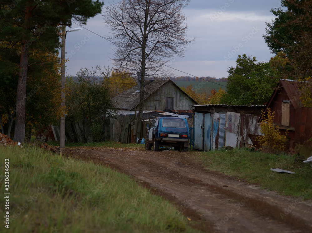 Poor life rural house autumn village and old car in Russia Poor life rural house autumn village and old car in Russia