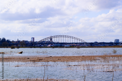 flooded river with the Waalbridge photo