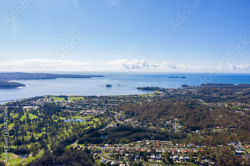 Panoramic aerial drone view of Batemans Bay on the New South Wales South Coast, Australia, looking out to Tasman Sea on a sunny day 