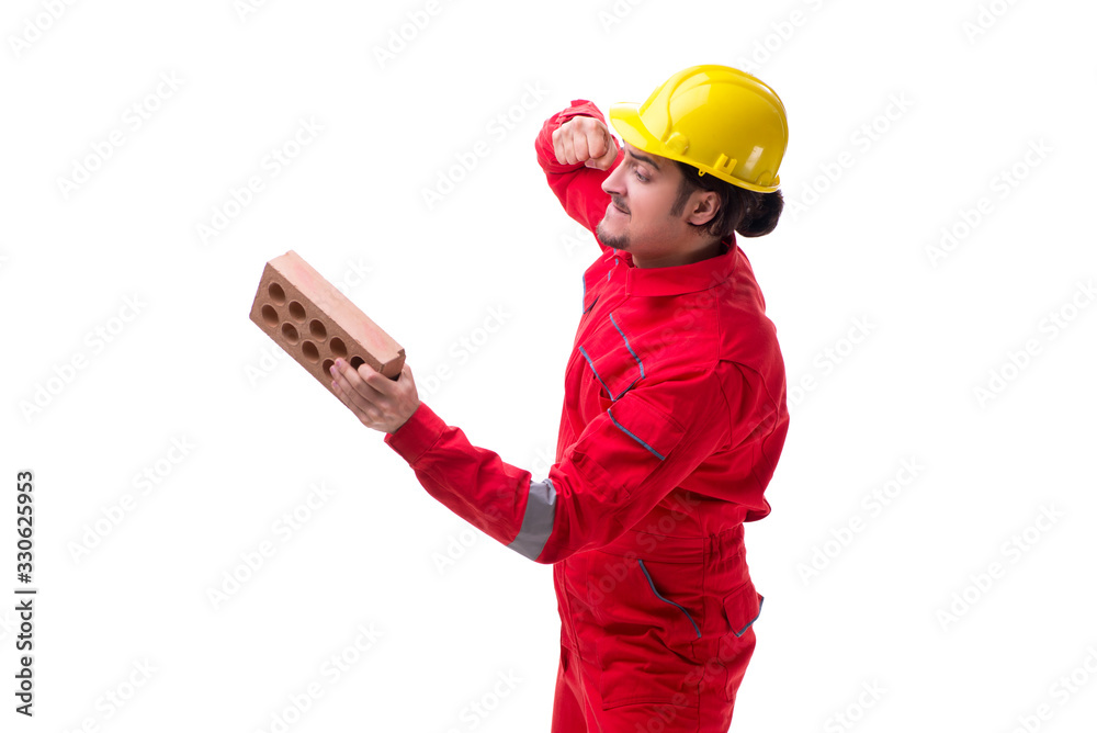 Young male mason with brick isolated on white Young male mason with brick isolated on white