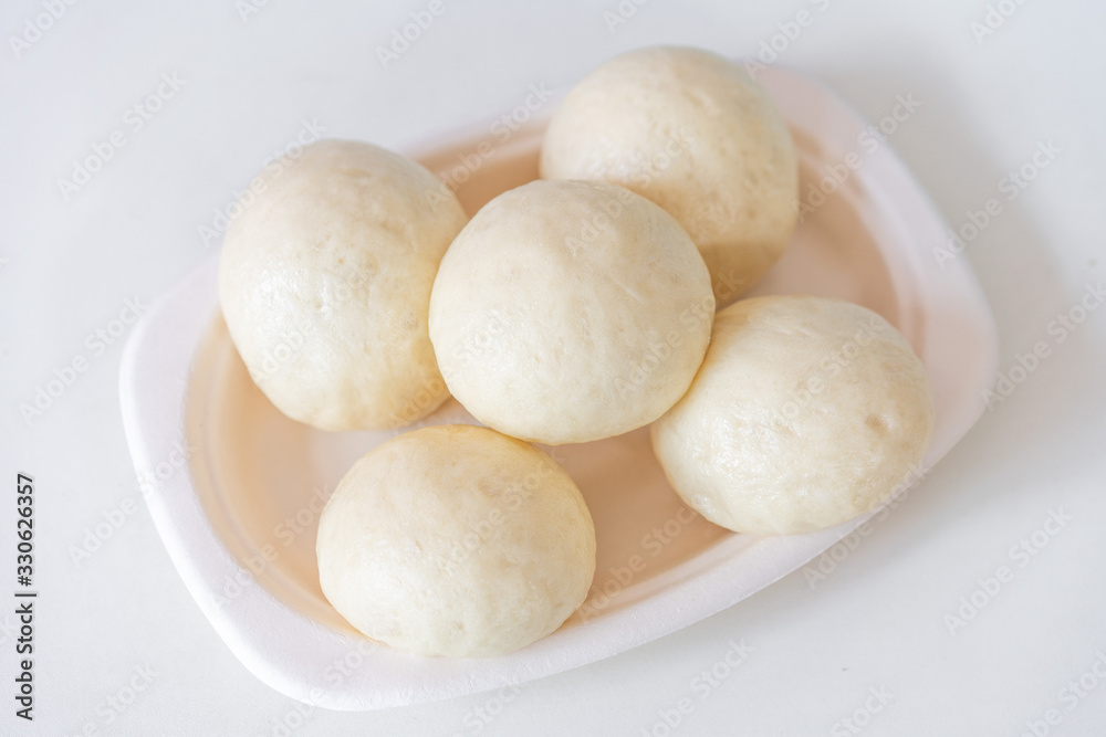 A dish of Chinese bread on a white background A dish of Chinese bread on a white background