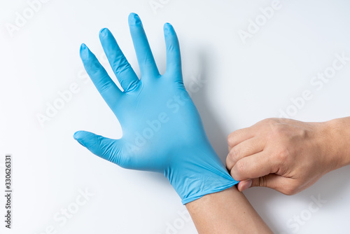 Hands are wearing nitrile gloves photo