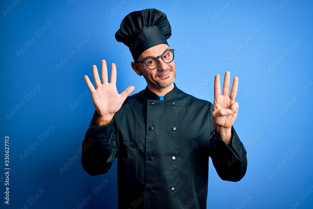 Young handsome chef man wearing cooker uniform and hat over isolated blue background showing and pointing up with fingers number eight while smiling confident and happy. Young handsome chef man wearing cooker uniform and hat over isolated blue background showing and pointing up with fingers number eight while smiling confident and happy.