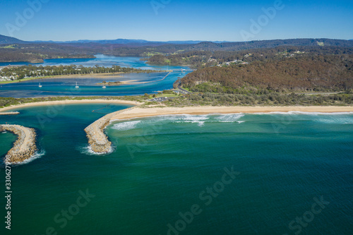 Aerial drone view of Wagonga Head and Wagonga Inlet at Narooma on the New South Wales South Coast, Australia, on a sunny day 
