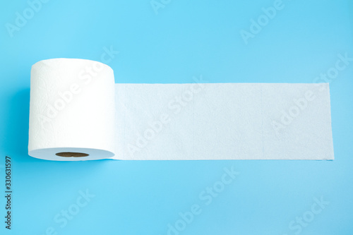 One toilet paper roll isolated on blue background