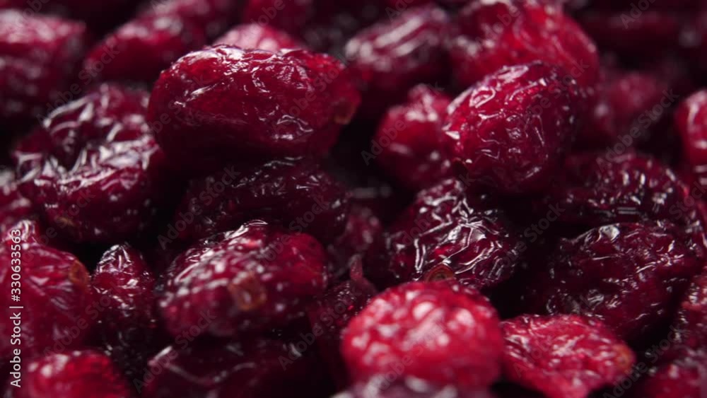 Berries of red dried cranberries close-up. Slow rotation. Dolly macro shot. Berries of red dried cranberries close-up. Slow rotation. Dolly macro shot.