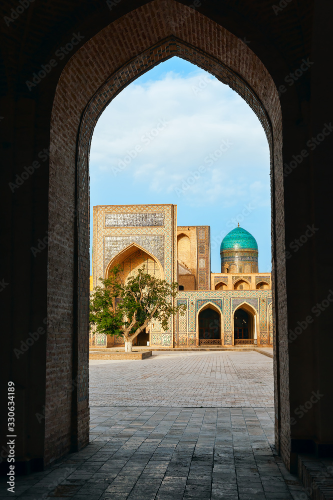 View of the inner courtyard at Islamic religious complex Po-i-Kalyan from the arch.Bukhara.Uzbekistan