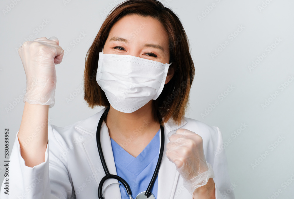 asian doctor wear the medical mask to protect and fight infection from germ, bacteria, covid19, corona , sars , influenza virus on white background. asian doctor wear the medical mask to protect and fight infection from germ, bacteria, covid19, corona , sars , influenza virus on white background.