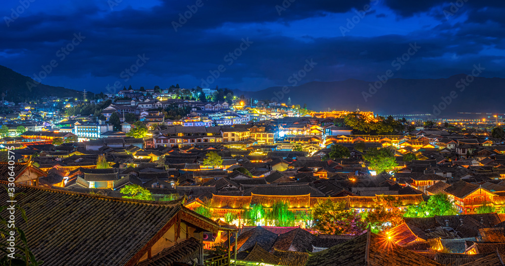 Fototapeta Panorama Top view scene of ancient LiJiang old town at twilight time, is the historical center of Lijiang City, in Yunnan, China.It is a UNESCO World,culture and traditional,travel and tourist concept