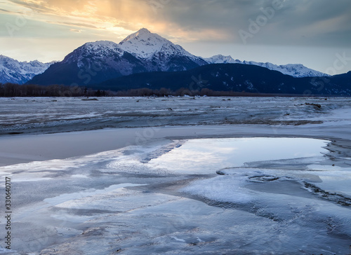 Chilkat river sunset with mountains photo