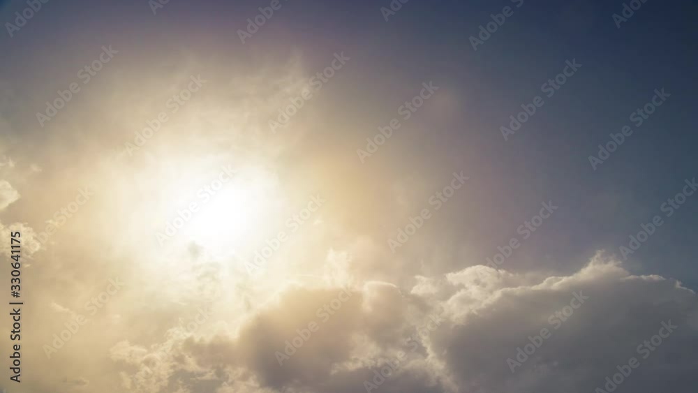 4k time-lapse of sun passing through moving clouds 