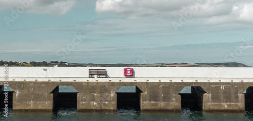 pier with bench and life ring