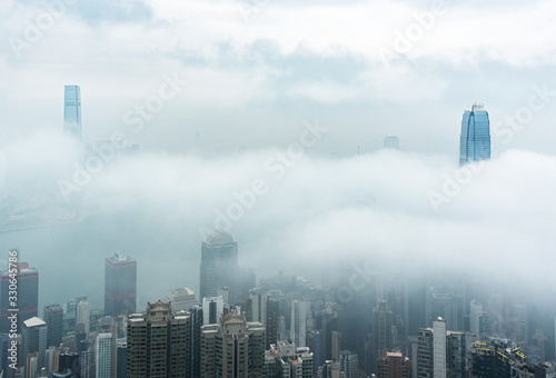 Canvas Print Skyline of Victoria harbor of Hong Kong city in fog