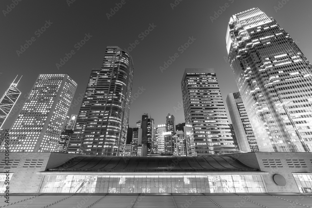 Modern office building and skyline of Hong Kong City at dusk