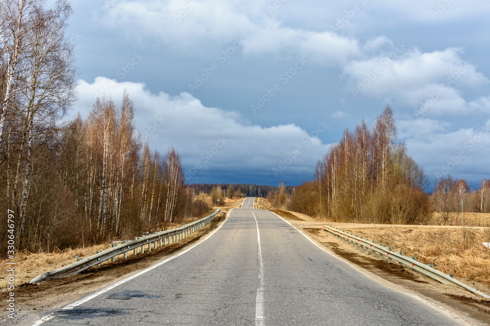 Suburban road is going into the distance Suburban road is going into the distance