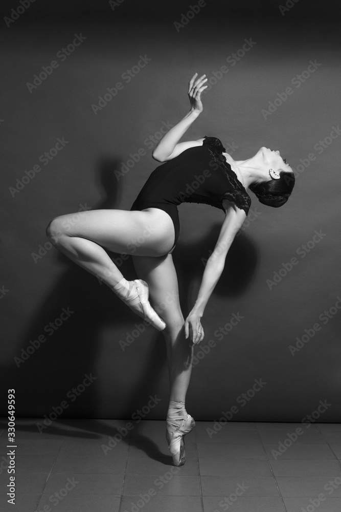 black and white vintage dramatic portrait of a dancing girl-ballerina