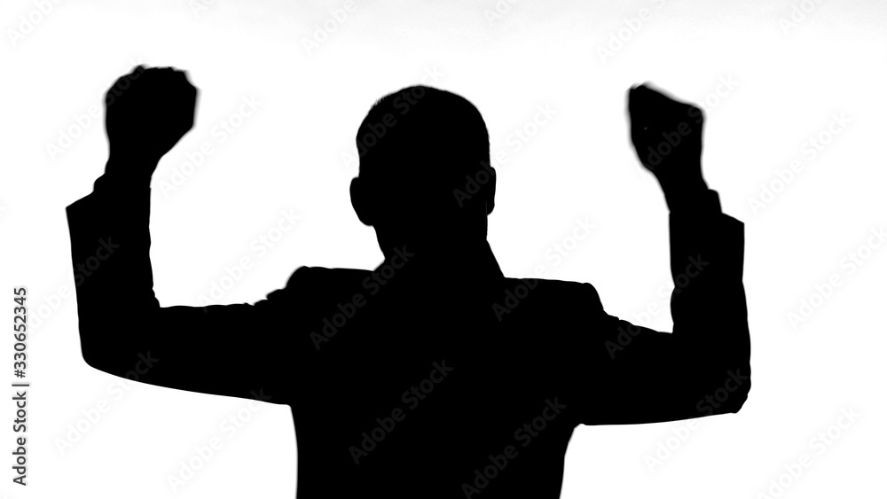 The Silhouette of Man Dancing Against White Background