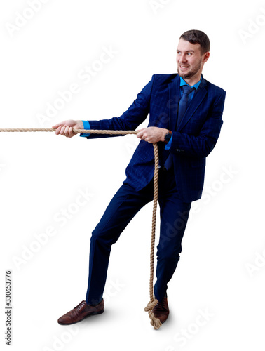Young businessman pulls a rope.