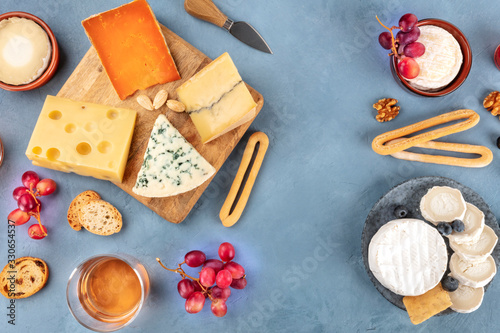 Cheese assortment. Goat cheese, Camembert, blue cheese etc, shot from the top with copy space