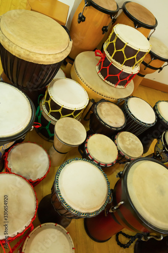 Various types of drums placed in a music classroom