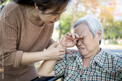 Φωτογραφία Asian old people is crying,elderly woman with depression is bored of herself,fee