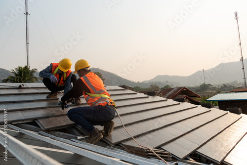 Construction Industry. Roofer with Ceramic Tiles in Hands. Roof Worker Closeup. House Rooftop Covering  Roof construction.