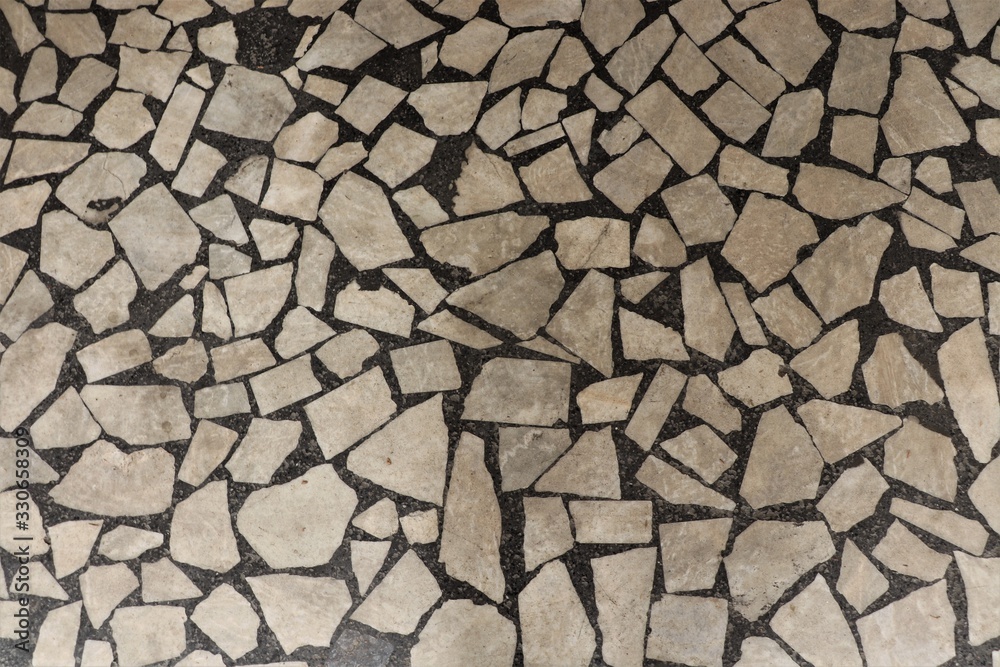 Marble surface in black with beige geometric accents. Marble surface in black with beige geometric accents.