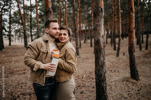 Love story of Oleg and Anastasia. Stylish photo shoot in the forest in cloudy weather.