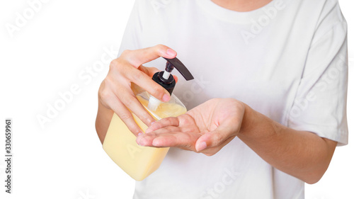 Woman hand pressing plastic pump bottle soap for cleaning, Isolate on white background, Global healthcare and infection concept.