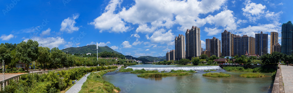 Cities and rivers under blue sky and white clouds