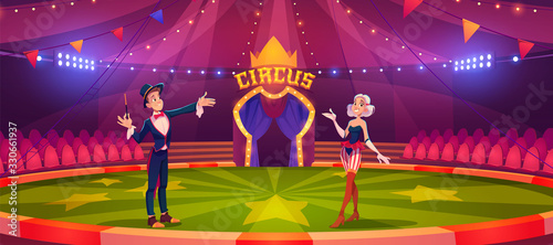 Foto Magician and woman on circus arena