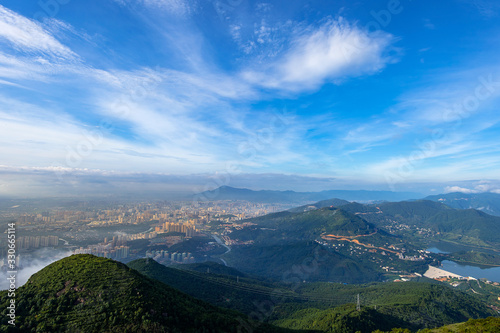 Fototapeta Naklejka Na Ścianę i Meble -  The mountain overlooks the rich town