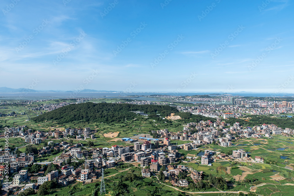 Fototapeta premium The mountain overlooks the rich town