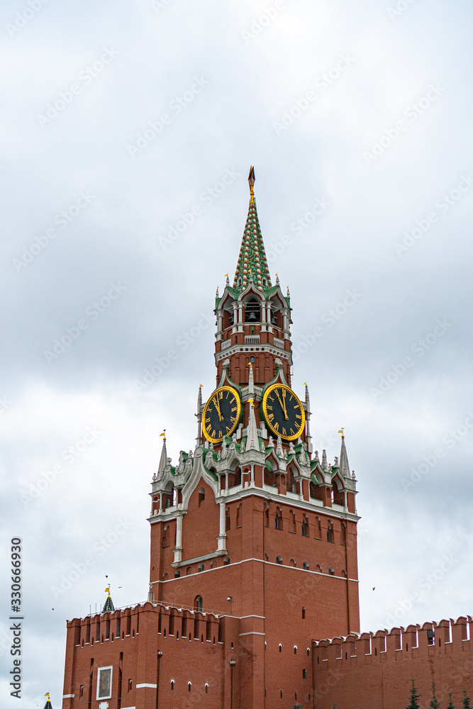 Spasskaya tower in Moscow on Red Square in cloudy weather Spasskaya tower in Moscow on Red Square in cloudy weather