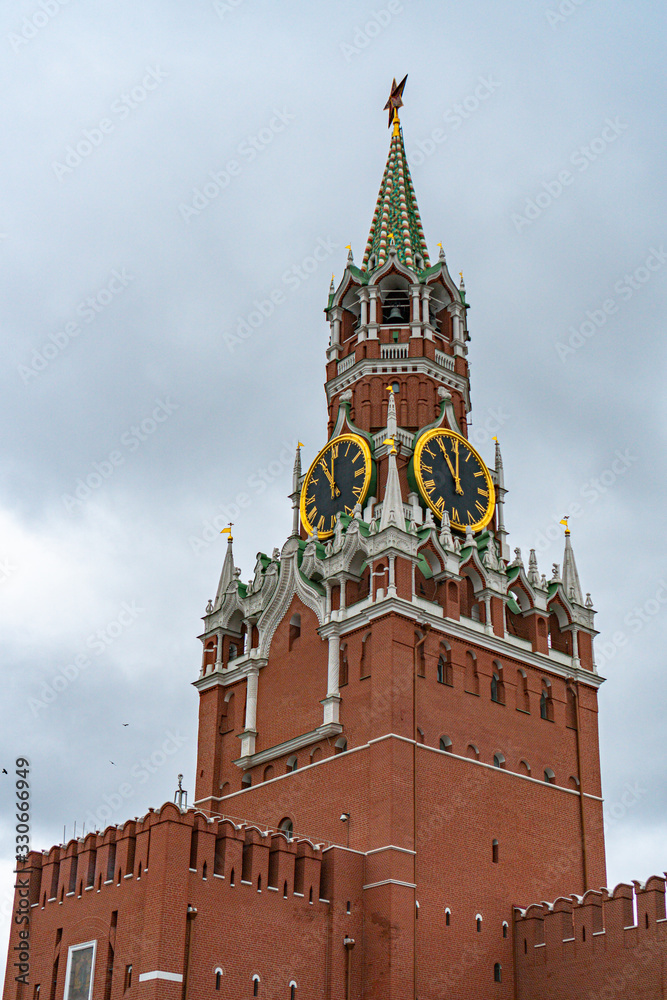 Spasskaya tower in Moscow on Red Square in cloudy weather Spasskaya tower in Moscow on Red Square in cloudy weather