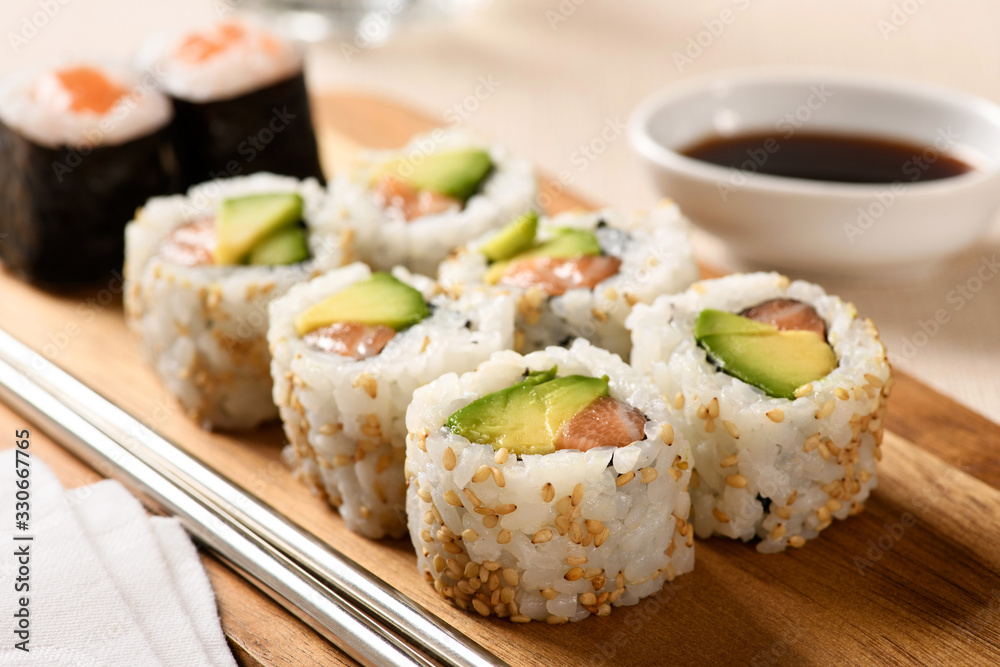 Close up on a serving of uramaki sushi Close up on a serving of uramaki sushi