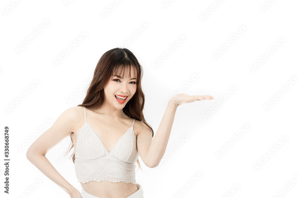 Portrait of attractive asian young woman with beauty skin and face present something on her hand isolated on white background. Healthy skin and face care concept. Portrait of attractive asian young woman with beauty skin and face present something on her hand isolated on white background. Healthy skin and face care concept.